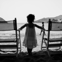 A little girl gazing the sea